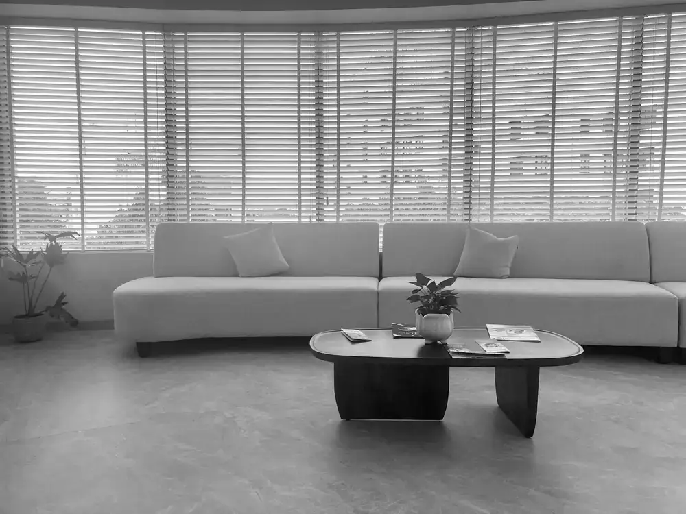 Curved sofa and natural wood coffee table